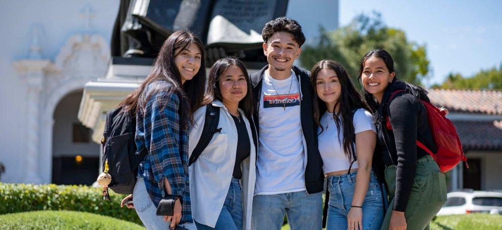 Students standing together in a group smiling on Saint Mary's College Campus